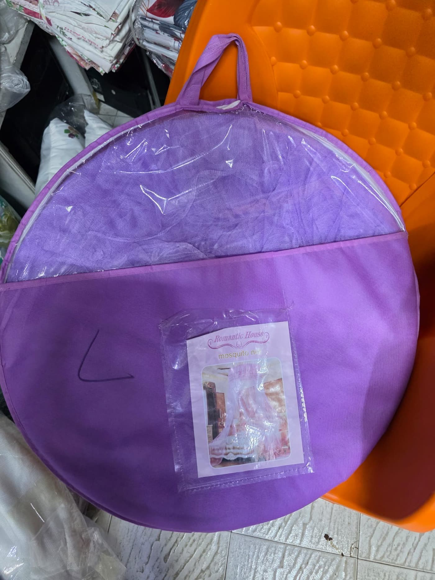 Purple mosquito net, packaged