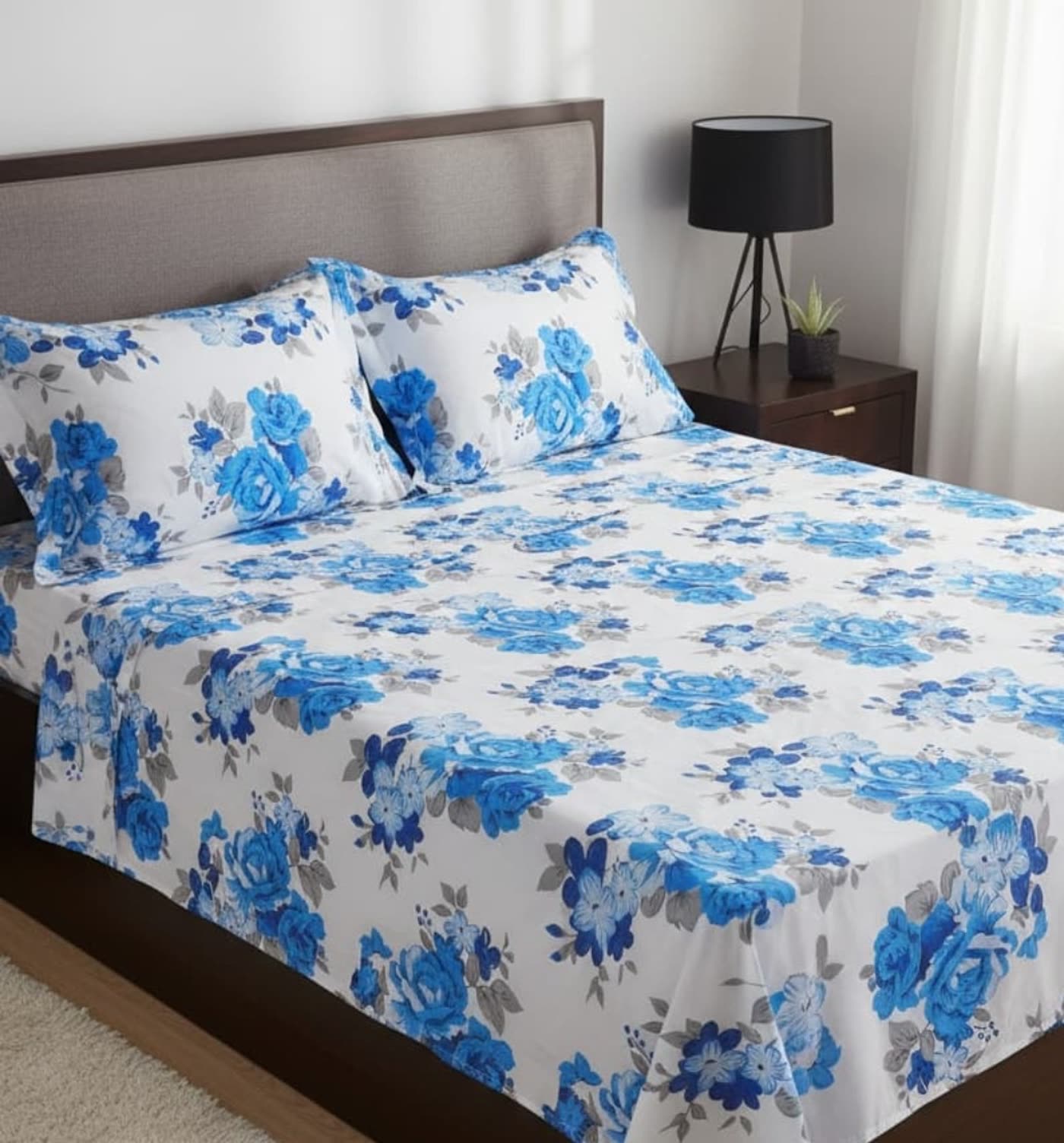 Bedding styled in blue rose print